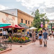 People walking through Boulder promenade